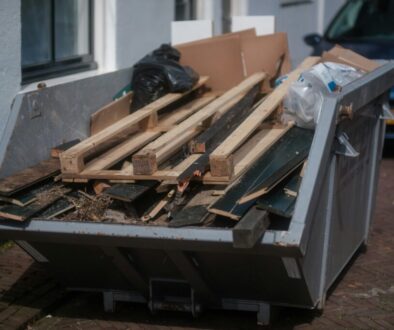 Junk Removal Broomfield Neighborhoods: Dumpster filled with wood debris for safe and eco-friendly disposal, keeping homes and yards clean and organized.