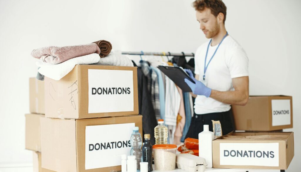 Recycling and donation Pueblo – people donating clothes, books, and household items to support eco-friendly junk removal and local charities