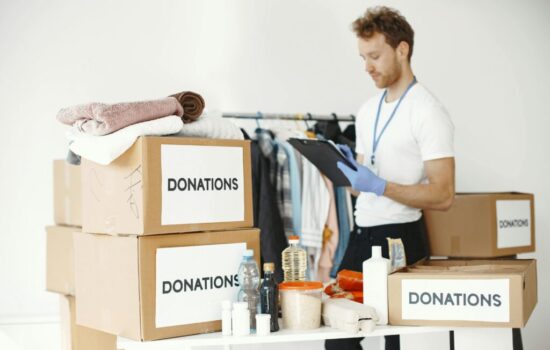 Recycling and donation Pueblo – people donating clothes, books, and household items to support eco-friendly junk removal and local charities