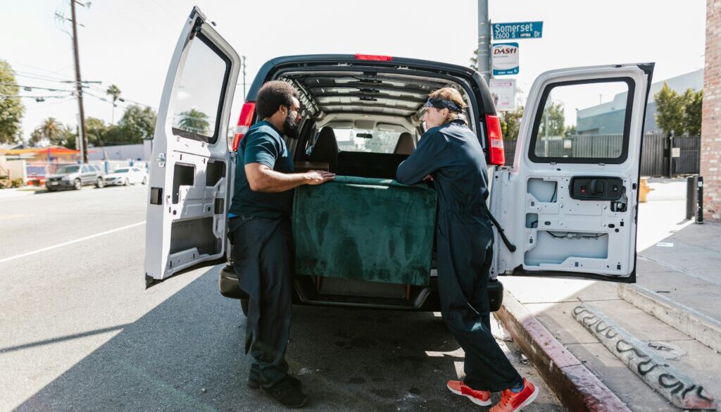 Professional junk removal Greeley CO team clearing household clutter into Junk Extricators truck