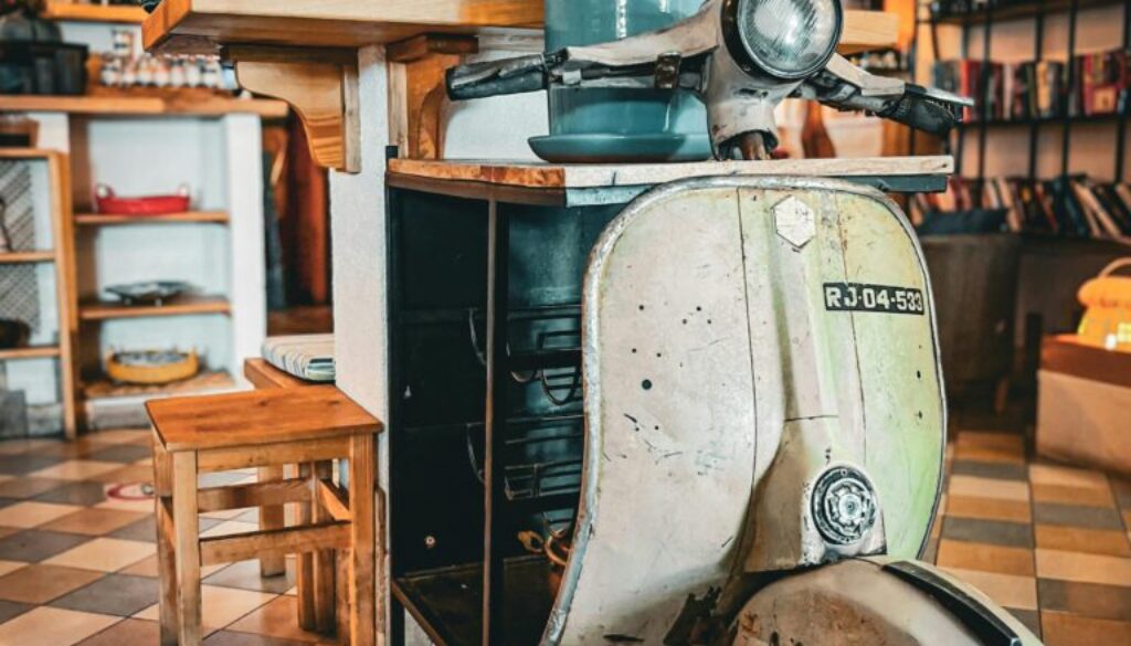 Repurpose old items Colorado Springs – old scooter turned into a functional shelf as a creative and eco-friendly DIY project