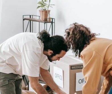 Decluttering Before Moving Broomfield: Homeowner sorting belongings and preparing items for professional junk removal to save time and reduce moving stress.
